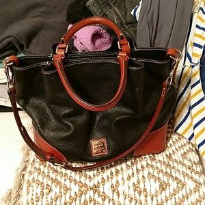 Hand bag with shoulder strap.